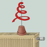 Книжна змия, поставена на горещ радиатор